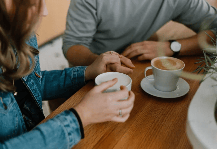 Group of people chatting over coffee