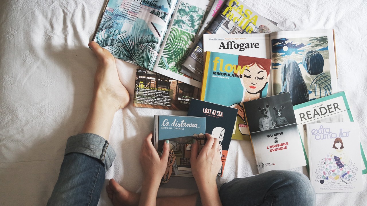 Canva---Flay-lay-of-Woman-Reading-Magazines-on-Bed