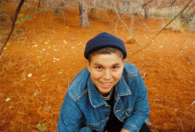 carissa-in-forest-looking-up-smiling