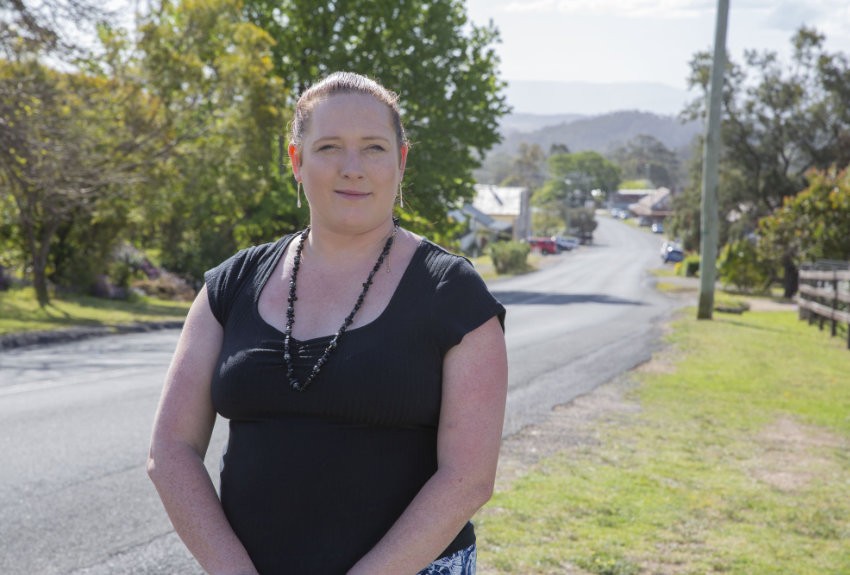 Haley standing beside the main road leading in to her home town of Wolumla