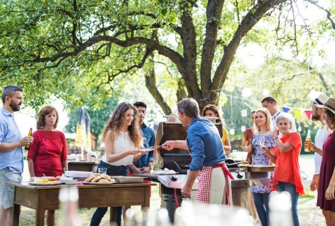 People wait for food at a family barbeque 