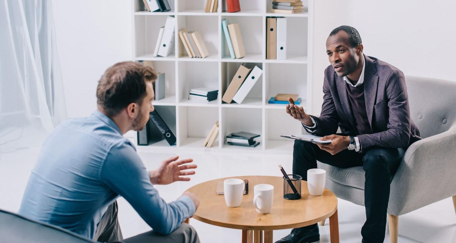 Psychiatrist speaking with patient