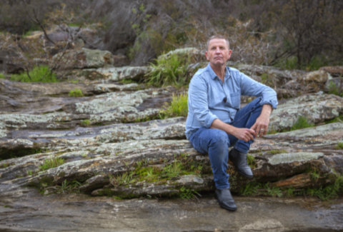 Life After Bushfires campaign - Butch, bushfire victim, sitting by the river