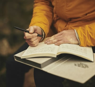 Person writing in diary
