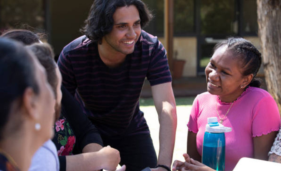 Group of people sitting outside talking