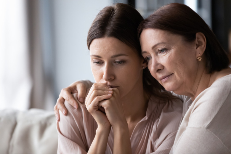 Mother and daughter grieving